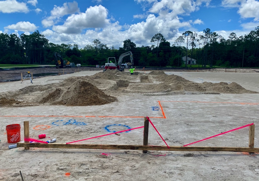 Footings Are Dug & Progress on Retention Pond